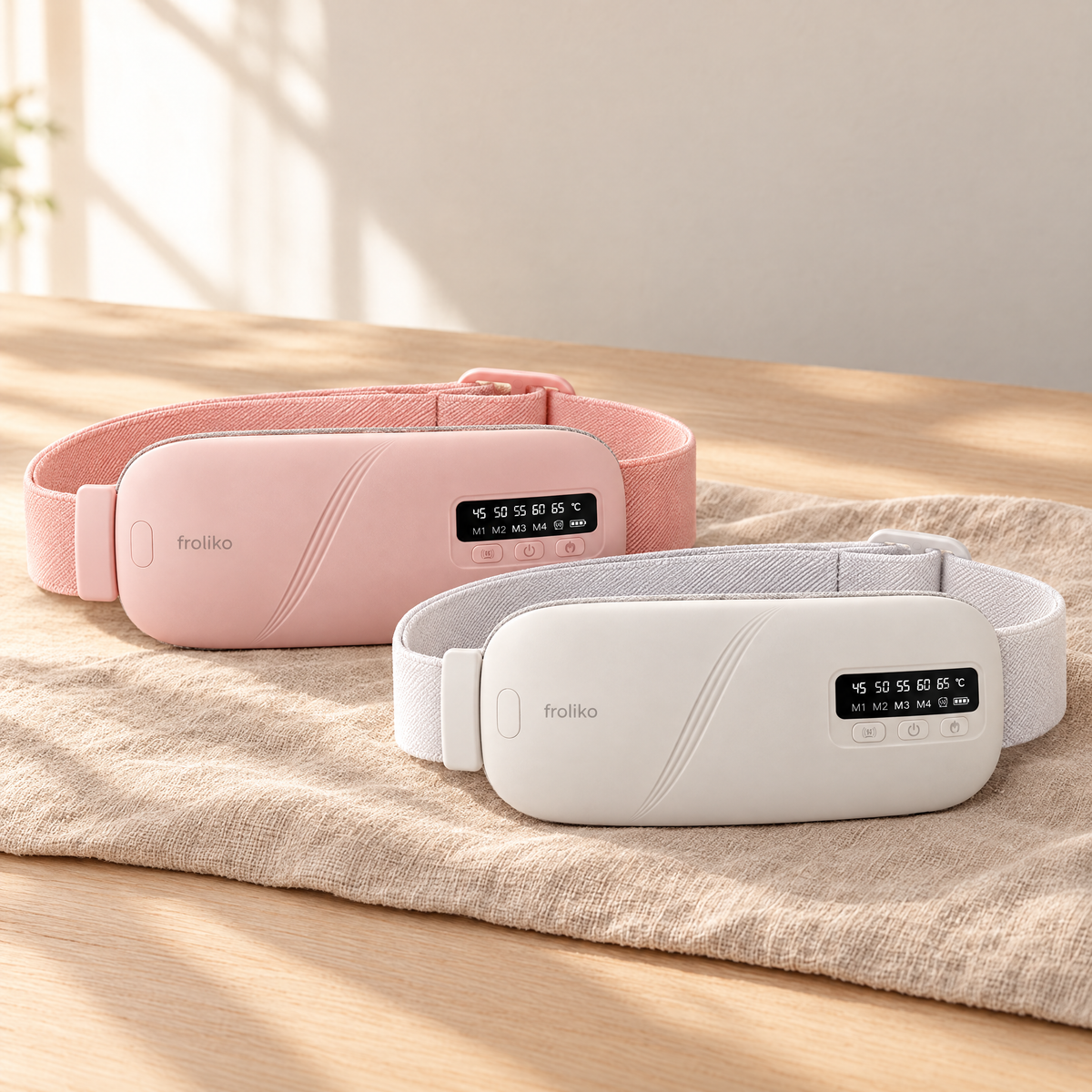 Two Froliko heat belts, pink and white